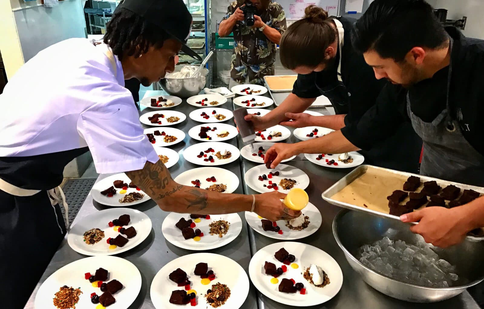 EAT chefs plating desserts for a catered event