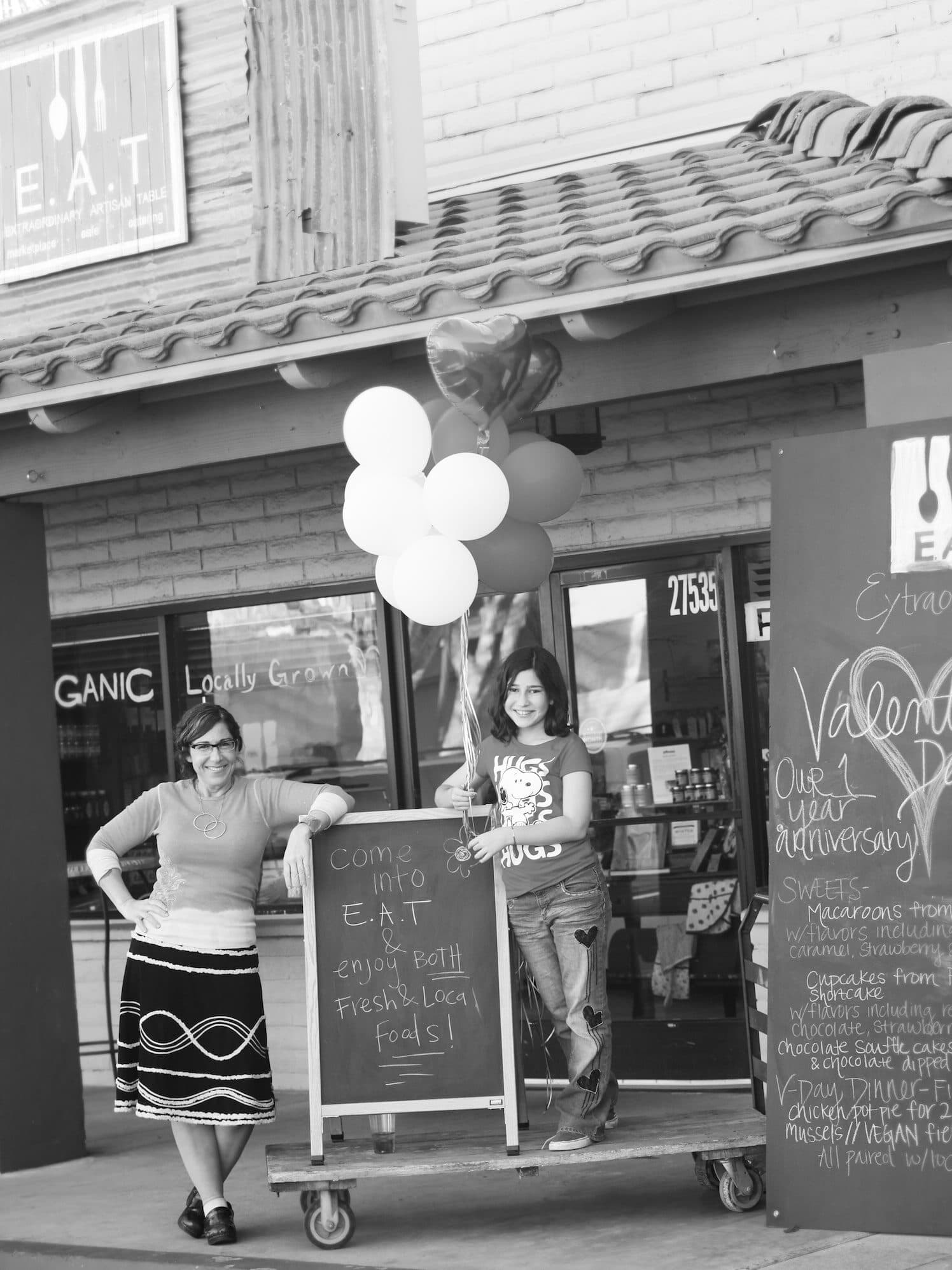 Chef Leah and family outside the original EAT storefront
