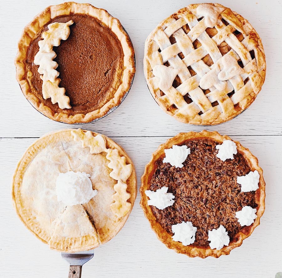 four different fall themed pumpkin pies